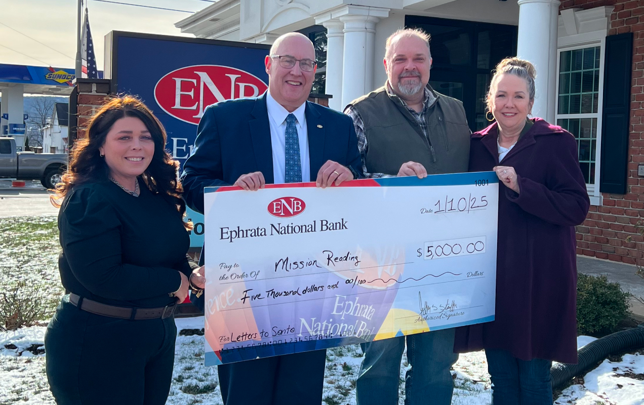 Ephrata national bank employees holding an oversized check
